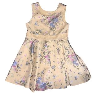 Yellow floral babydoll dress with lace trimmed belt and flower details